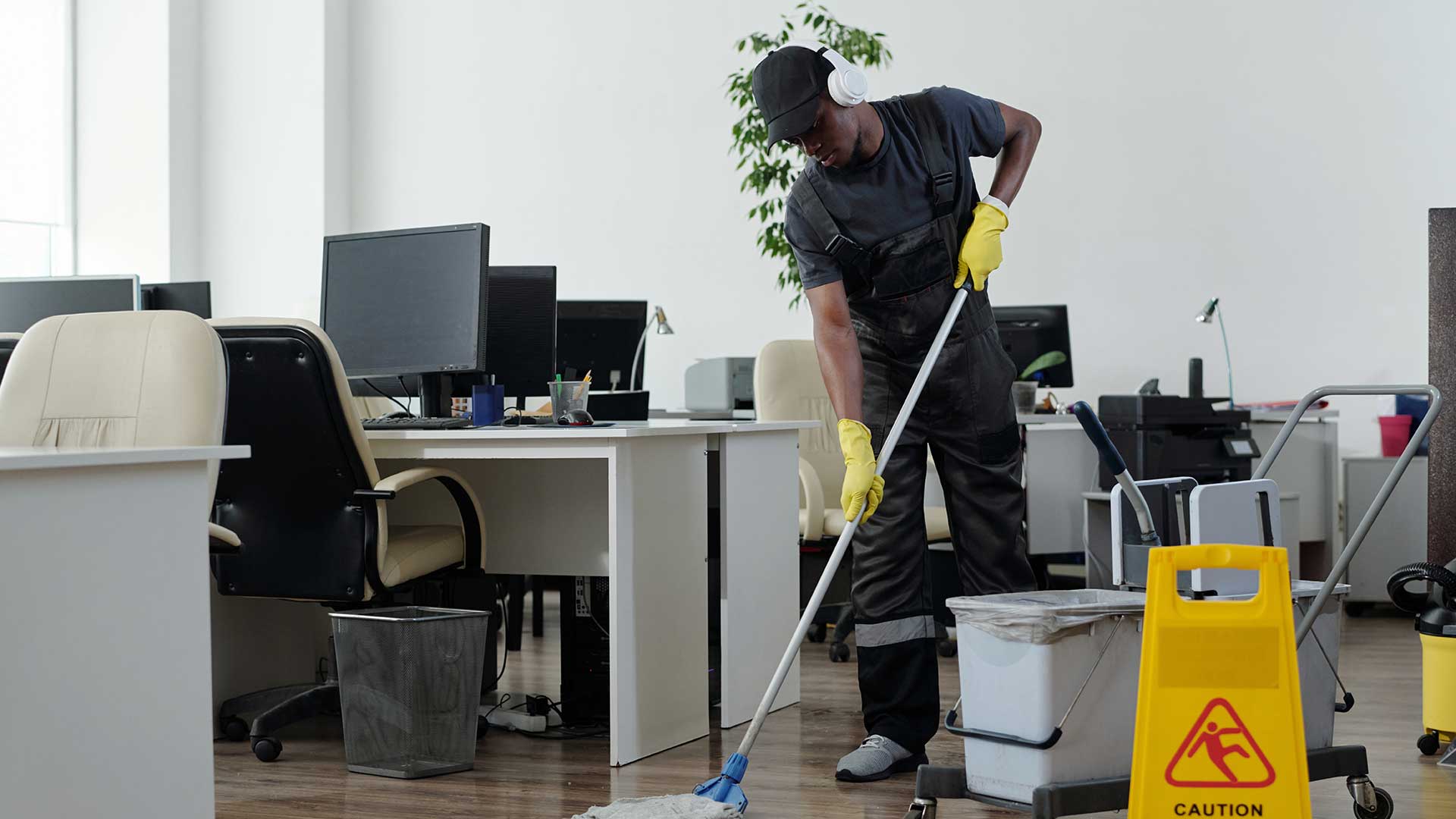 Monarch staff sanitizing an office space