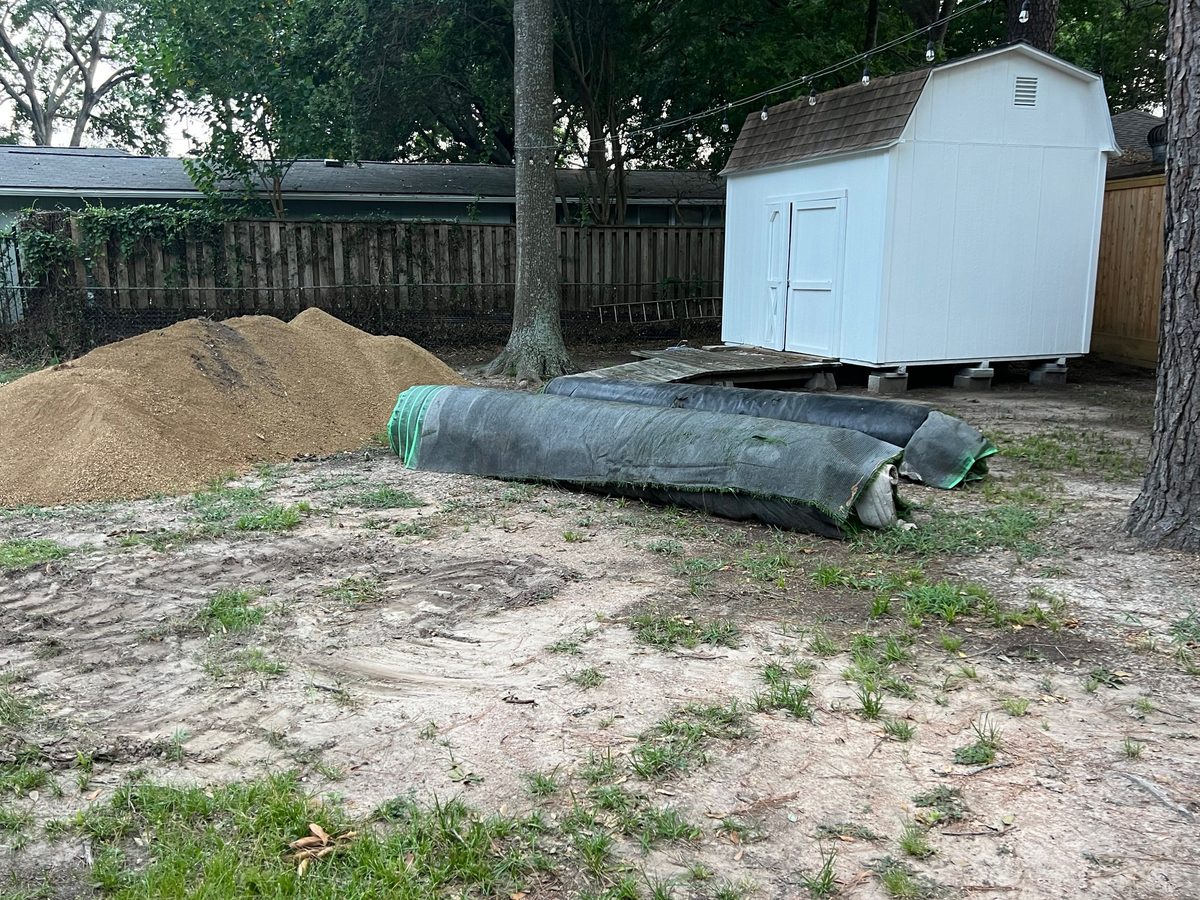 Turf rolls and infill materials staged on site before install